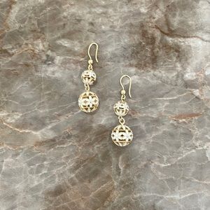 Gold tone and enamel flowered design hanging earrings.